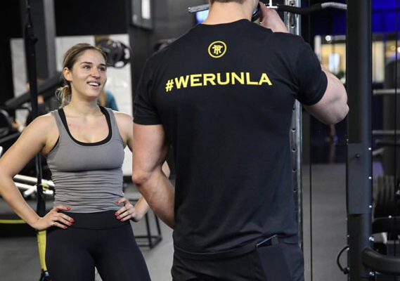 young woman working with personal trainer in Beverly Hills